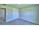 Bedroom featuring neutral carpet, double door closet and fresh paint at 4032 Tullamore Ln, Auburndale, FL 33823