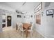 Well-lit dining room with tile flooring, rustic decor, and seating for six at a wooden table at 404 Emerald Cove Loop, Lakeland, FL 33813