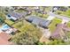 Aerial view of a single-Gathering home featuring a large backyard with a fenced perimeter at 4059 The Fenway, Mulberry, FL 33860