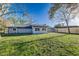 Large backyard with a well-maintained lawn and a new wooden fence ensures privacy at 4059 The Fenway, Mulberry, FL 33860