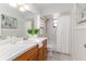 Bathroom features a vanity, tiled floor, and tub with shower at 4059 The Fenway, Mulberry, FL 33860