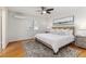 Cozy bedroom with ceiling fan, light walls, and neutral decor at 4059 The Fenway, Mulberry, FL 33860