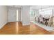 Entryway leading to dining room offers hardwood floors, and natural light at 4059 The Fenway, Mulberry, FL 33860