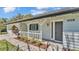 Close up of the front of the home highlighting the front porch, home address, and detailed exterior at 4059 The Fenway, Mulberry, FL 33860