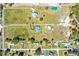 A bird's eye view highlighting the home's position on an extensive lot with defined property lines and mature trees at 408 Old Bartow Lake Wales Rd, Bartow, FL 33830