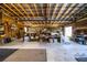 Barn interior with concrete floors, exposed beams, and workspace with storage for any hobby at 408 Old Bartow Lake Wales Rd, Bartow, FL 33830