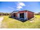 Charming barn exterior shows the ample garage/storage space and room for vehicles or other equipment on the property at 408 Old Bartow Lake Wales Rd, Bartow, FL 33830