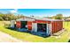 A barn with open doors revealing storage space and equipment at 408 Old Bartow Lake Wales Rd, Bartow, FL 33830