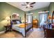 Green bedroom featuring traditional furnishing, a four-poster bed and a ceiling fan at 408 Old Bartow Lake Wales Rd, Bartow, FL 33830