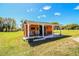 Exterior view of a charming small house with a covered porch and simple landscaping at 408 Old Bartow Lake Wales Rd, Bartow, FL 33830