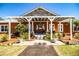 Inviting front porch with white pergola, decorated door, and lush plants at 408 Old Bartow Lake Wales Rd, Bartow, FL 33830