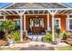 Close up of inviting front porch with decorated door and plants at 408 Old Bartow Lake Wales Rd, Bartow, FL 33830