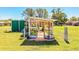 Exterior view of backyard greenhouse with brick base, surrounded by lush lawn and greenery, offering serene horticultural space at 408 Old Bartow Lake Wales Rd, Bartow, FL 33830