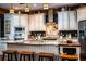 Well-lit kitchen featuring granite countertops, stainless steel appliances, and a center island with seating at 408 Old Bartow Lake Wales Rd, Bartow, FL 33830