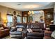 Comfortable living room featuring hardwood floors and comfortable leather seating at 408 Old Bartow Lake Wales Rd, Bartow, FL 33830