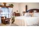 Main bedroom features a four-poster bed with a neutral palette and traditional decor at 408 Old Bartow Lake Wales Rd, Bartow, FL 33830