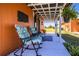 Outdoor porch with chairs, and hanging plants, perfect for relaxing and enjoying the surroundings at 408 Old Bartow Lake Wales Rd, Bartow, FL 33830