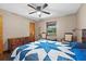 Bedroom featuring a ceiling fan, wood-look floors, neutral paint, and well-lit window at 4410 Rushing Rd, Lakeland, FL 33810