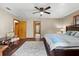 The primary bedroom has wood floors, ceiling fan, and a sitting area at 4410 Rushing Rd, Lakeland, FL 33810