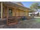 Charming wood home with welcoming front porch and wood stairs at 4410 Rushing Rd, Lakeland, FL 33810