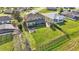 Aerial shot of a large backyard with plenty of room for activities, featuring a screened patio at 4512 Brookshire Pl, Lake Wales, FL 33898