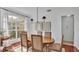 Dining area with neutral walls, a large window and a table set for six at 4512 Brookshire Pl, Lake Wales, FL 33898