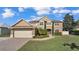 Traditional two story home exhibits a manicured front lawn at 4512 Brookshire Pl, Lake Wales, FL 33898