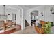 Bright foyer with wood and tile flooring leading to the dining and living areas at 4512 Brookshire Pl, Lake Wales, FL 33898