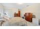 A cozy bedroom featuring a bed, dresser, and ample closet space at 4908 S Bedford Ln, Lakeland, FL 33813