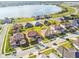 Beautiful aerial view of homes in a lakeside community with lush lawns and mature landscaping at 4929 Tennessee Lake Dr, Auburndale, FL 33823