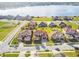 Nice aerial view of several homes with lush lawns in a lakeside neighborhood at 4929 Tennessee Lake Dr, Auburndale, FL 33823