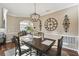 Cozy dining room featuring hardwood floors, stylish chandelier, and decorative wall art at 4929 Tennessee Lake Dr, Auburndale, FL 33823