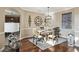 Elegant dining room with hardwood floors, a chandelier, and neutral color scheme at 4929 Tennessee Lake Dr, Auburndale, FL 33823