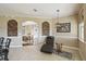 Living room featuring tile flooring, arched openings, and comfortable lounge seating at 4929 Tennessee Lake Dr, Auburndale, FL 33823