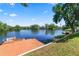 Scenic view of a private wooden dock on the lake with mature trees at 502 Lake Harris Dr, Lakeland, FL 33813