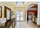 Bright foyer with soaring ceilings and elegant double-door entrance at 502 Lake Harris Dr, Lakeland, FL 33813