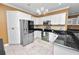 Bright, updated kitchen with stainless steel appliances and granite countertops at 502 Lake Harris Dr, Lakeland, FL 33813