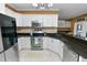 Well-equipped kitchen with granite countertops and stainless steel appliances at 502 Lake Harris Dr, Lakeland, FL 33813