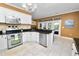 Open kitchen layout featuring stainless steel appliances and breakfast bar at 502 Lake Harris Dr, Lakeland, FL 33813