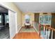 Upstairs landing area with hardwood floors and a sitting area at 502 Lake Harris Dr, Lakeland, FL 33813