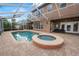 Backyard oasis with screened in pool and hot tub, perfect for relaxation and outdoor entertainment at 502 Lake Harris Dr, Lakeland, FL 33813