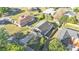 Aerial shot of a home with a spacious backyard, featuring a playset and storage shed at 5207 St Lucia Dr, Lakeland, FL 33812