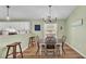 Open dining area featuring hardwood floors and modern light fixture at 5207 St Lucia Dr, Lakeland, FL 33812