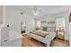 Serene bedroom featuring hardwood floors, vaulted ceilings, and a neutral color palette, promoting relaxation at 5207 St Lucia Dr, Lakeland, FL 33812