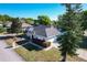 An elevated view of a well-maintained home with a lush green lawn and beautiful landscaping at 5730 Tanasi Ct, Lakeland, FL 33812