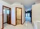 Spacious bathroom with tile floors, a closet, and doorway leading to the bedroom at 5730 Tanasi Ct, Lakeland, FL 33812