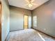 Bedroom features carpet flooring, ceiling fan and natural light from the window at 5730 Tanasi Ct, Lakeland, FL 33812