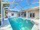 Large screened-in pool and patio with seamless access to the home's interior at 5730 Tanasi Ct, Lakeland, FL 33812