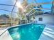 Refreshing screened-in pool, ideal for swimming and enjoying the outdoors at 5730 Tanasi Ct, Lakeland, FL 33812