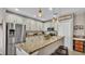 Kitchen featuring a breakfast bar with barstool seating, stainless steel appliances, and granite countertops at 5798 Dornich Dr, Auburndale, FL 33823